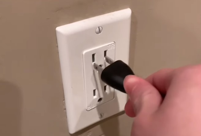 Unplug a television from the wall socket